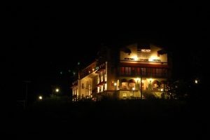 Jerome Grand Hotel at night illuminated by dim yellow lighting